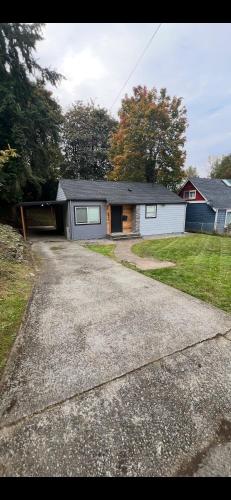 a house with a garage and a driveway at Hidden Gem in Seattle in Seattle