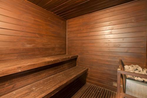 a wooden sauna with wooden walls and wooden shelves at Lakeshore Hotel & Apartments in Dhaka