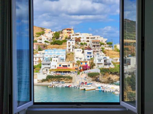 a view of a harbor from a window at Blue Bay Lifestyle - ex Bali Blue Bay in Balíon