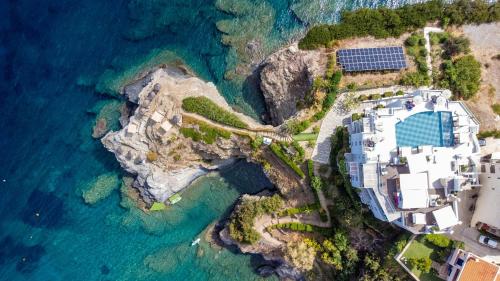 an aerial view of a house on a cliff next to the ocean at Blue Bay Lifestyle - ex Bali Blue Bay in Balíon