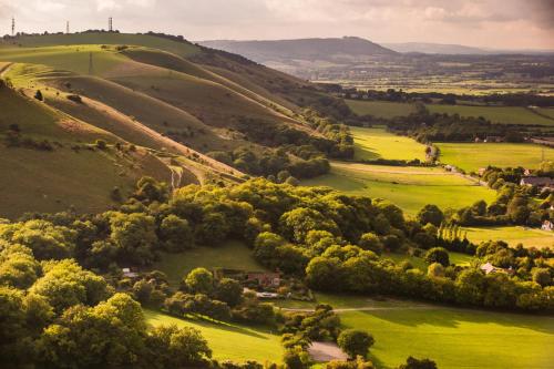 an aerial view of a green valley with trees at Crouchers Hotel in Chichester