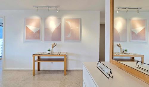 a room with a table and a mirror on a wall at Skyview Bukit Bintang Fairlane Residence #24 in Kuala Lumpur