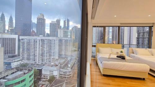a living room with a view of a city at Skyview Bukit Bintang Fairlane Residence #24 in Kuala Lumpur