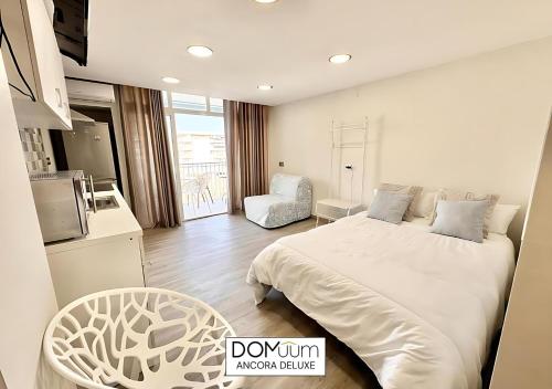 Postel nebo postele na pokoji v ubytování DOMuum Holidays - ANCORA Studio II
