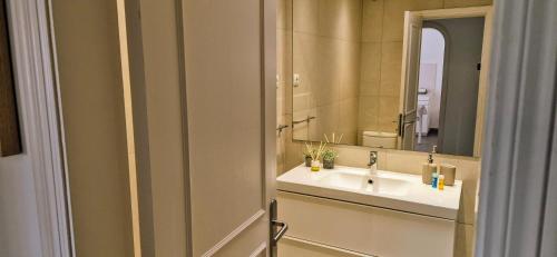 a bathroom with a sink and a mirror at HANDICAP 7 Bungalow 4 in San Bartolomé