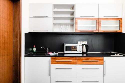 Kuchyň nebo kuchyňský kout v ubytování Apartmanovy dom Familia Smokovec