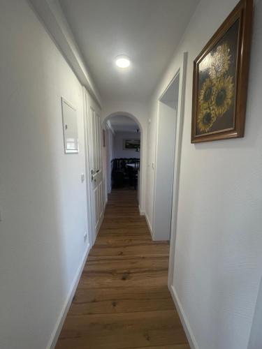 a hallway with white walls and a picture on the wall at Herche Hof in Ranstadt
