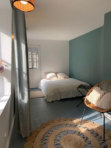 Giường trong phòng chung tại Appartement Coeur historique de Bayeux