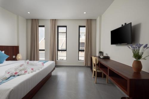 Ένα ή περισσότερα κρεβάτια σε δωμάτιο στο Angkor Channary Hotel