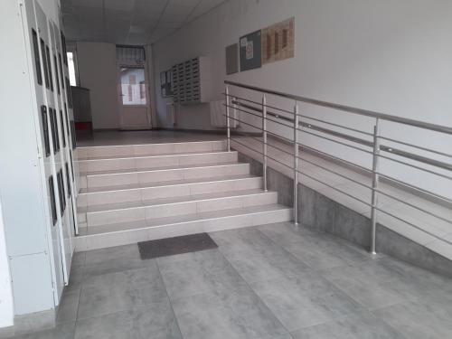 an empty room with stairs in a building at Nikola NS in Novi Sad