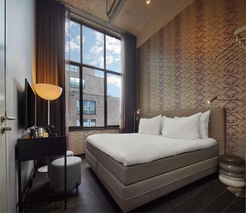 Postel nebo postele na pokoji v ubytování WestCord Hotel Eindhoven