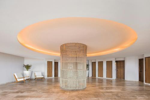 a large room with a large ceiling at Almare, a Luxury Collection Resort, Isla Mujeres, Adult All-Inclusive in Isla Mujeres