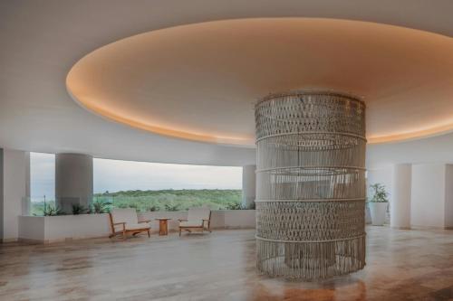 a large room with a large column in the middle at Almare, a Luxury Collection Resort, Isla Mujeres, Adult All-Inclusive in Isla Mujeres