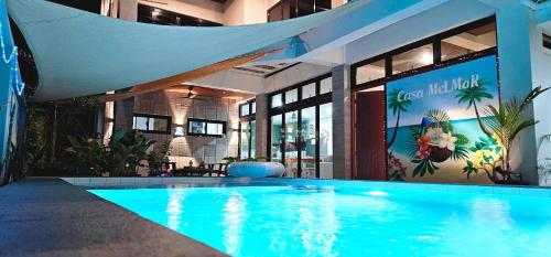 a large swimming pool in front of a building at Casa Mel Mar Luxurious 3BR 3FullBR Villa with Pool in Panglao