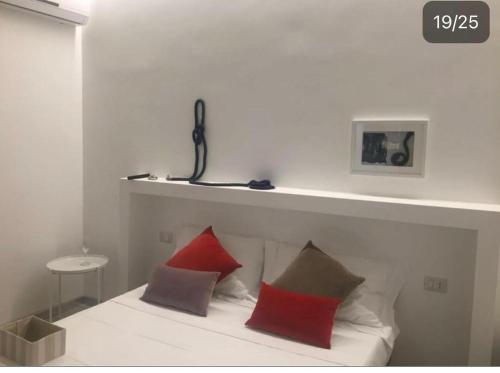 Postel nebo postele na pokoji v ubytování piazza Marconi Rooms