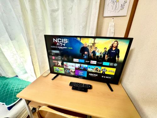 a computer monitor sitting on top of a desk at Shirahama in Miyazaki