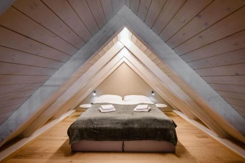 a bedroom with a bed in a loft at Villa Daniela in Úvaly