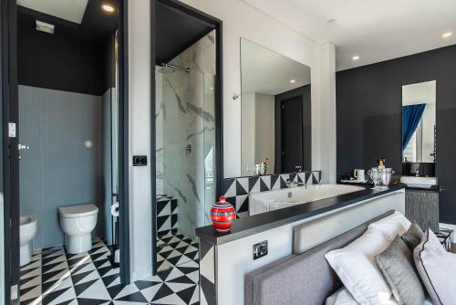Kúpeľňa v ubytovaní Gram Suites