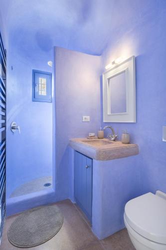 a blue bathroom with a sink and a toilet at Seaside 5BDR Bliss in Mykonos in Merchia Beach