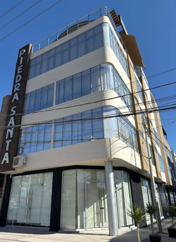 a building with a lot of glass windows at HOTEL PIEDRA SANTA - Moquegua in Moquegua
