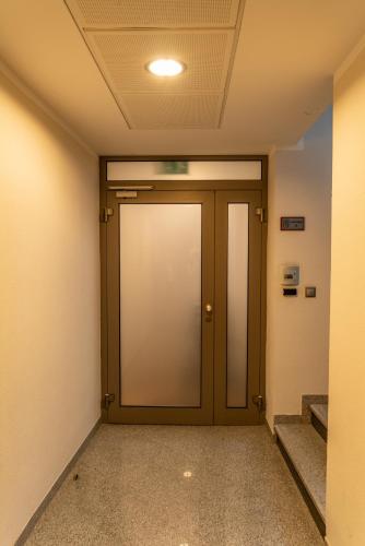 a corridor with a door in a building at P23 Apartments in Bratislava