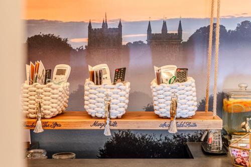 a shelf with a display of cell phones on it at Altalena Luxury Rooms and Spa in Siena