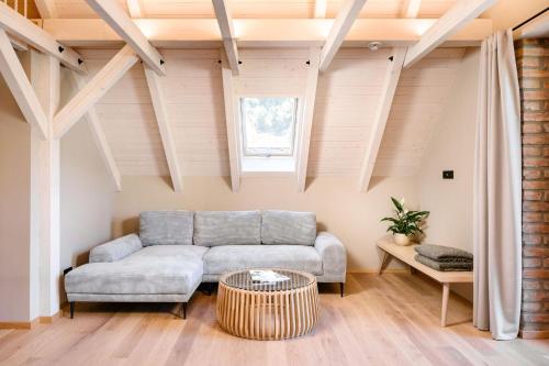 a living room with a couch and a table at Villa Daniela in Úvaly