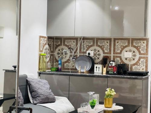 a kitchen with a table and a counter top at luxury private studio In Zirakpur in Ghaggar