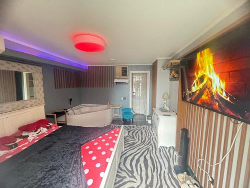 a room with a bed with a zebra blanket at Apartman Banja Luka CITY in Banja Luka