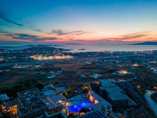 an aerial view of a city at night at Mykonos Rocks Villas & Suites in Mýkonos City