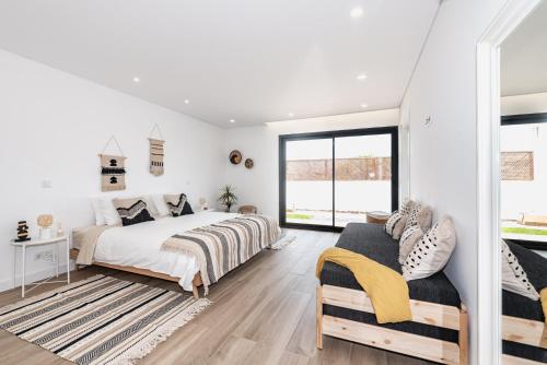 En eller flere senge i et værelse på Casa da Oliveira ~ Azeitão