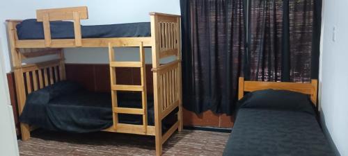 two bunk beds sitting next to each other in a room at temporary rental Mendoza in Guaymallen