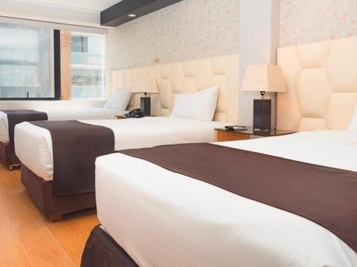 Cama o camas de una habitación en Hotel Ferré Miraflores