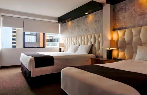 Cama o camas de una habitación en Hotel Ferré Miraflores