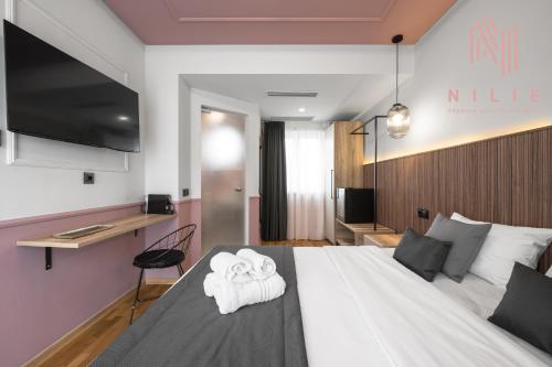 Katil atau katil-katil dalam bilik di Esther Suites, Nilie Hospitality MGMT