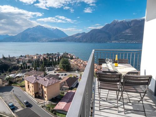 a balcony with a view of the water and mountains at Lake Dream 1 Lake View of COMO in Bellano