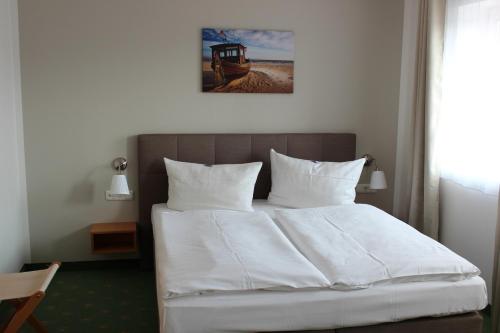 Hotel und Restaurant "Zur Zwiebel"にあるベッド
