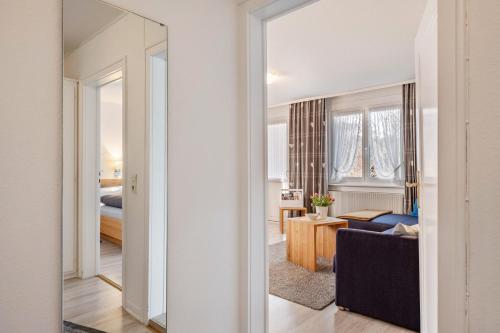 a view of a living room with a mirror at Ferienwohnung Dachtler in Hinterzarten