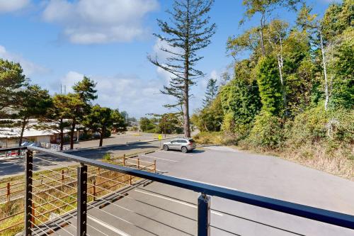 a car driving down a street with a parking lot at Serenity at Deerhaven #B & #C in Gold Beach