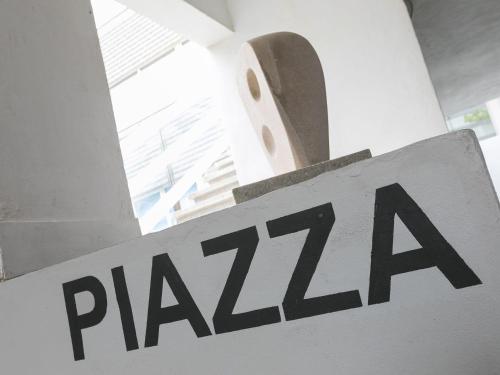 a sign for a pizza restaurant in a building at Louies Loft in St Ives
