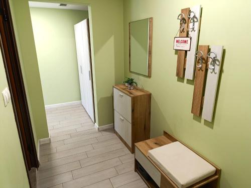 a hallway with a mirror and a dresser in a room at Lime house in Kyustendil