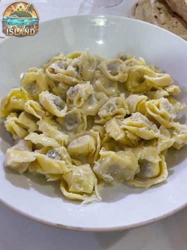 a plate of pasta on a white plate at The Island in Sharm El Sheikh