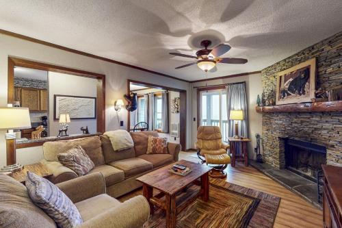 a living room with a couch and a fireplace at The Pinnacle Inn 3318 in Beech Mountain