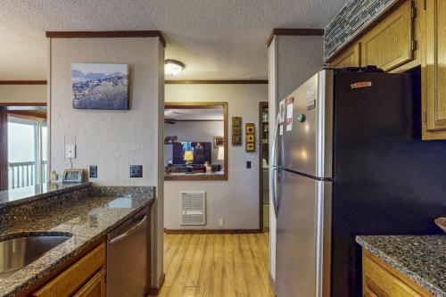 a kitchen with a stainless steel refrigerator at The Pinnacle Inn 3318 in Beech Mountain