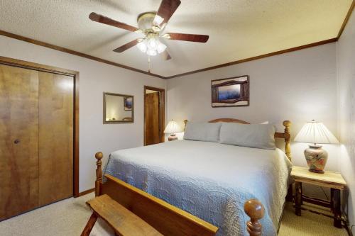 a bedroom with a bed and a ceiling fan at The Pinnacle Inn 3318 in Beech Mountain