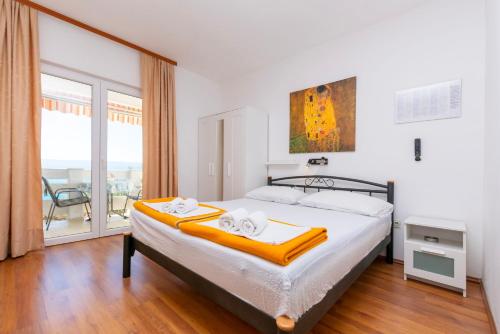 Posteľ alebo postele v izbe v ubytovaní Apartments Ivo