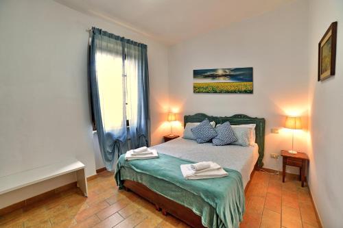 Postel nebo postele na pokoji v ubytování Borgo Faldo - Appartamento con Terrazzo - 117