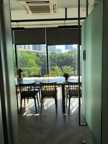 a dining room with a table and chairs at Mari's space in Nonthaburi
