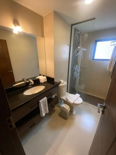 Koupelna v ubytování Mai Suites Apart Hotel