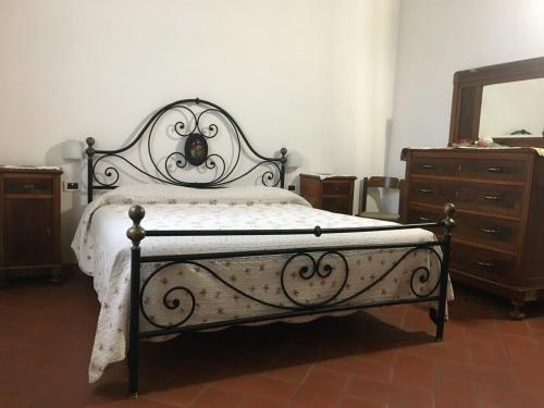 Ένα ή περισσότερα κρεβάτια σε δωμάτιο στο Agriturismo L'Ulivo